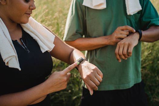 Athlete checking a recovery score on a fitness watch after training