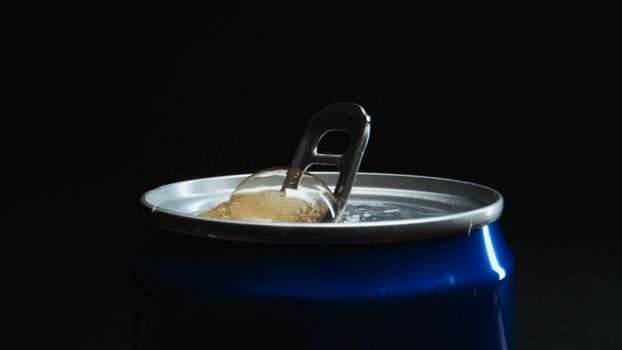 Opening a carbonated drink, bubbles fizzing out