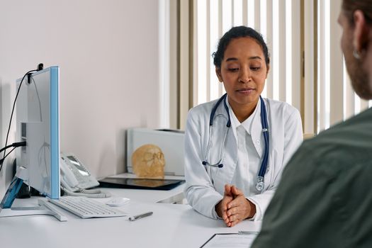 Patient consulting with a doctor in an office
