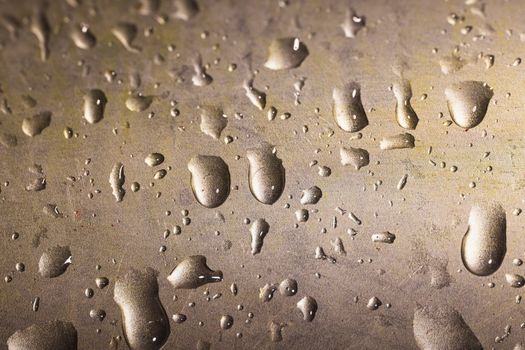 Close-up of water droplets on metal