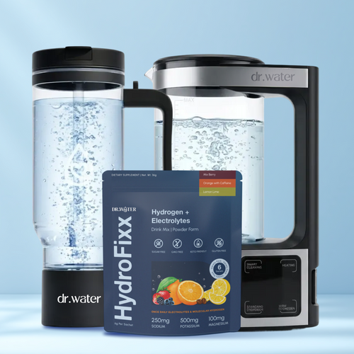 Family Hydration Essentials bundle hero — clear Dr.Water HydroPitcher with bubbling hydrogen water on the left, stainless-steel HydroDaily glass kettle with black handle on the right, and a navy HydroFixx Hydrogen plus Electrolytes carton in the foreground, on a soft light-blue backdrop.